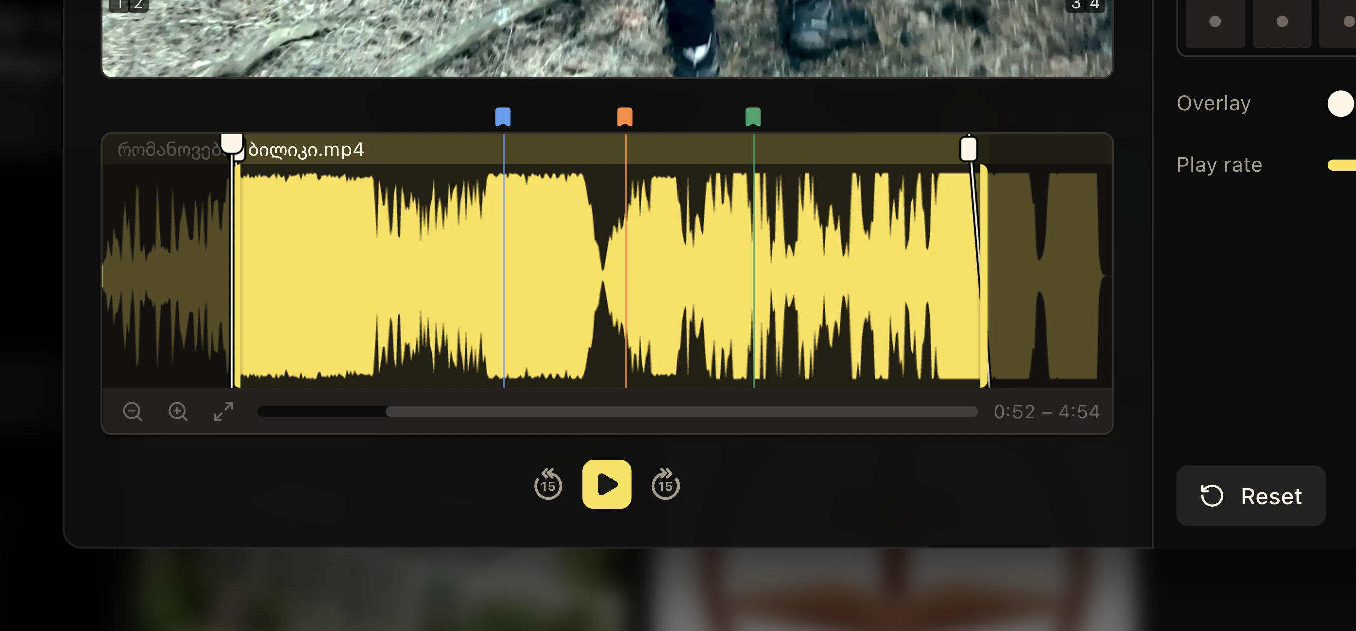 Close view of a Media Inspector waveform with trim handles, fades, playhead, bookmarks, and playback controls